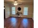 Living area features wood flooring, neutral paint, and a ceiling fan at 266 Sagamore Dr, Louisburg, NC 27549