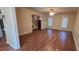 Spacious living room featuring wood floors, neutral paint, ceiling fan, and stairway access at 266 Sagamore Dr, Louisburg, NC 27549