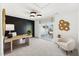 This is a home office that features black accent wall, a sliding glass door, and modern light fixture at 2906 Kempthorne Rd # 54, Cary, NC 27519
