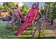 Creative cardinal-themed playground structure with climbing nets and slide at 2906 Kempthorne Rd # 54, Cary, NC 27519