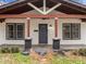 Charming home with a covered front porch, stylish pillars, and well-lit entrance at 2908 Woods Pl, Raleigh, NC 27607