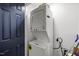 Compact laundry area with stacked washer and dryer for space-saving convenience at 2908 Woods Pl, Raleigh, NC 27607