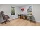 Bright office space featuring wood floors, natural light, and a versatile workspace with an executive desk and rolling chair at 2908 Woods Pl, Raleigh, NC 27607
