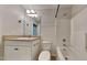 Well-lit bathroom features a single sink vanity, toilet, and shower-tub combo with modern fixtures at 300 Nelson Ln, Clayton, NC 27527