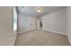 Well-lit bedroom with carpet, window, and a double door closet for ample storage at 300 Nelson Ln, Clayton, NC 27527