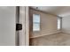 Bright bedroom with two windows, plush carpeting, and neutral walls for a cozy atmosphere at 300 Nelson Ln, Clayton, NC 27527