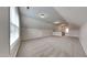 Spacious bonus room with neutral carpeting and ample natural light, perfect for flexible living at 300 Nelson Ln, Clayton, NC 27527