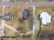 Aerial view showing the house's position relative to other houses in the neighborhood with mature landscaping at 301 W Hill S Ave, Hillsborough, NC 27278