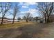Spacious backyard featuring ample parking and mature trees, offering a blend of functionality and natural beauty at 301 W Hill S Ave, Hillsborough, NC 27278