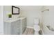 Updated bathroom with modern vanity, mirror, toilet, and fixtures at 301 W Hill S Ave, Hillsborough, NC 27278