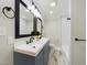 Bathroom with dual sinks and a large mirror at 301 W Hill S Ave, Hillsborough, NC 27278
