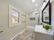 Bathroom featuring a white vanity, shower, and natural light at 301 W Hill S Ave, Hillsborough, NC 27278