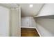 Walk-in closet with shelves and hardwood flooring at 301 W Hill S Ave, Hillsborough, NC 27278