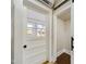 Interesting sliding door with glass panes to a closet or storage area at 301 W Hill S Ave, Hillsborough, NC 27278