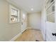 Bright entryway with neutral walls, tiled floor, and windows at 301 W Hill S Ave, Hillsborough, NC 27278