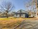 Charming single Gathering home featuring wood siding, updated windows and mature trees on a spacious lot at 301 W Hill S Ave, Hillsborough, NC 27278