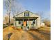 Charming home featuring a covered front porch, neutral siding, and well-maintained landscaping at 301 W Hill S Ave, Hillsborough, NC 27278