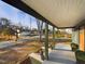 Spacious front porch offering an outdoor seating area and views of the neighborhood at 301 W Hill S Ave, Hillsborough, NC 27278