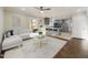 Open floor plan with a view from the living room to the modern kitchen with stainless steel appliances at 301 W Hill S Ave, Hillsborough, NC 27278
