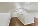 Bright loft space showcasing hardwood floors, skylight, and sloped ceilings at 301 W Hill S Ave, Hillsborough, NC 27278