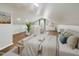 Spacious loft bedroom features hardwood floors, sloped ceilings, and natural light from skylights at 301 W Hill S Ave, Hillsborough, NC 27278