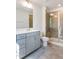 Modern bathroom featuring a glass shower and vanity with chrome hardware at 3019 Vitner Dr, Durham, NC 27704
