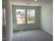 Bedroom provides views of a residential neighborhood, and features neutral carpet at 3019 Vitner Dr, Durham, NC 27704