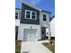 Charming townhome features a one-car garage and modern architectural details at 3019 Vitner Dr, Durham, NC 27704
