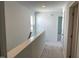 Bright hallway features neutral carpet, white walls and trim, and entryways to adjacent rooms at 3019 Vitner Dr, Durham, NC 27704