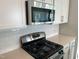 Gourmet kitchen features stainless steel appliances, subway tile backsplash, and modern gas range at 3019 Vitner Dr, Durham, NC 27704