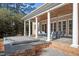 Serene backyard featuring a covered patio, pool with automatic cover, and comfortable seating, ideal for outdoor gatherings at 3605 Camp Mangum Wynd, Raleigh, NC 27612