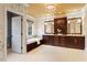 Spacious bathroom featuring a chandelier, double vanity, and soaking tub at 3605 Camp Mangum Wynd, Raleigh, NC 27612