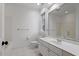 Bright bathroom with tiled floors, single sink vanity and a large mirror at 3605 Camp Mangum Wynd, Raleigh, NC 27612
