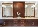 Bathroom featuring double sinks, granite countertops, and floral wallpaper at 3605 Camp Mangum Wynd, Raleigh, NC 27612