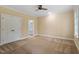 Spacious bedroom featuring neutral carpet, ceiling fan and ensuite bathroom at 3605 Camp Mangum Wynd, Raleigh, NC 27612