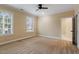 Spacious bedroom with carpet, a ceiling fan, and plenty of natural light at 3605 Camp Mangum Wynd, Raleigh, NC 27612