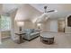 Attic bonus room with neutral carpet, couch, coffee table and ceiling fan at 3605 Camp Mangum Wynd, Raleigh, NC 27612