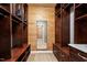 Walk-in closet featuring wooden shelving, and a mirror at the end of the room at 3605 Camp Mangum Wynd, Raleigh, NC 27612