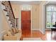 Welcoming foyer featuring hardwood floors, staircase and traditional architecture at 3605 Camp Mangum Wynd, Raleigh, NC 27612
