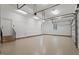 Spacious garage with epoxy floors, bright lighting, and ample room for multiple vehicles or storage at 3605 Camp Mangum Wynd, Raleigh, NC 27612