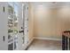 Hallway with french doors leading to a balcony overlooking the manicured lawn at 3605 Camp Mangum Wynd, Raleigh, NC 27612