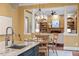 Open kitchen with breakfast area and view into the living room at 3605 Camp Mangum Wynd, Raleigh, NC 27612