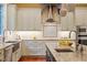 Beautiful kitchen with stainless hood, custom tilework, and open layout at 3605 Camp Mangum Wynd, Raleigh, NC 27612