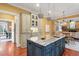 Spacious kitchen with center island, granite counters, and eat-in area at 3605 Camp Mangum Wynd, Raleigh, NC 27612
