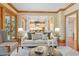A bright living room offering an open concept floor plan with views to the kitchen and outside at 3605 Camp Mangum Wynd, Raleigh, NC 27612