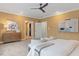 Bedroom with stylish decor, ceiling fan, two chairs and a modern dresser at 3605 Camp Mangum Wynd, Raleigh, NC 27612