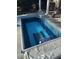 Sparkling in-ground pool with an automatic cover, surrounded by a patio, ideal for cooling off and enjoying the backyard at 3605 Camp Mangum Wynd, Raleigh, NC 27612