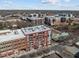 Aerial view showcasing multiple buildings in an urban area with blue skies at 400 Hunt St # 404, Durham, NC 27701