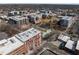 Aerial view showcases the neighborhood's architecture, street layout, and surrounding greenery at 400 Hunt St # 404, Durham, NC 27701