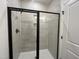 Modern bathroom with custom tiled shower and black hardware at 4301 Darius Lane # 28, Fuquay Varina, NC 27526